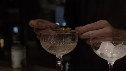 Decorating cocktail with olives Stock Footage 139782602