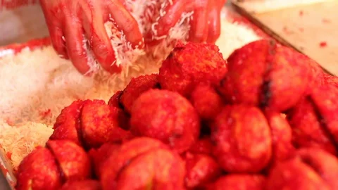 Decorating coconut Mexican bread called yoyo Stock-Footage 130086036