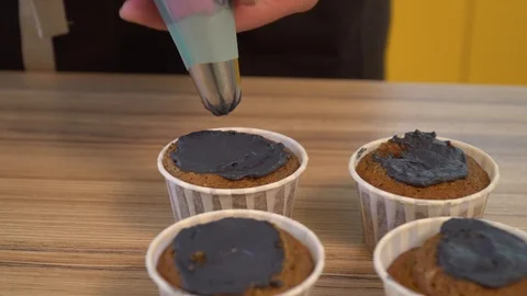 Decorating cup-cake with cream. Culinary master class design cupcakes, cream Stock Footage 86770371