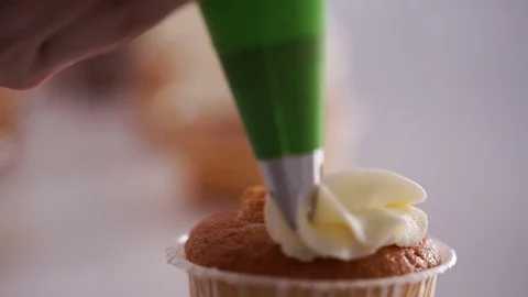 Decorating cup-cake with cream Stock Footage 73020485