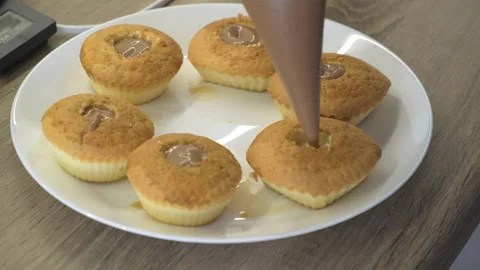 Decorating Cupcake with Black Coffee Cream. Using Cooking Bag, Muffins for Party Stock Footage 148802929