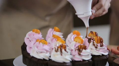 Decorating cupcakes Stock Footage 62450204