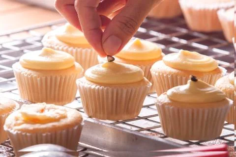 Decorating cupcakes Stock Photos