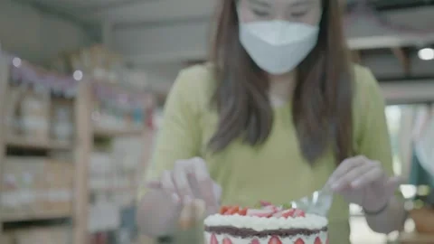 Decorating a Delicious Cake with Fresh Toppings and Care Stock Footage 327577866