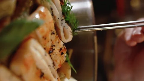 Decorating the dish with herbs. Slow motion. 120 fps. Vertical video Stock Footage 172440087