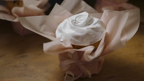 Decorating Easter cupcakes with white icing by hand Stock Footage 308320602