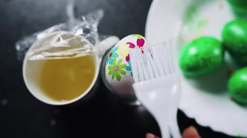 Decorating Easter Eggs With Patterns and Bright Holiday Colors Stock Footage 304353421