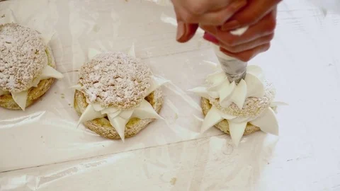 Decorating the eclair on the wooden table Stock Footage 74478016