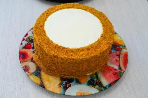 Decorating a festive cake handmade by a master pastry chef. Stock Photos