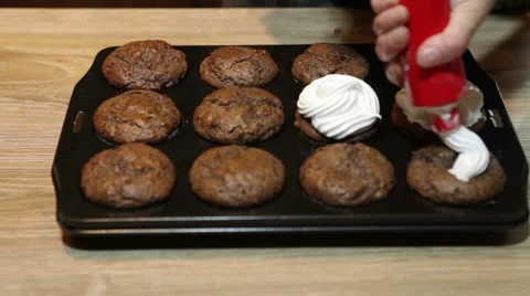 Decorating fresh muffins Stock Footage 46742695