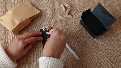 Decorating a gift for a birthday gift Stock Footage 151020997