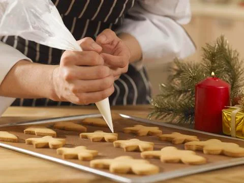 Decorating ginger bread man Stock Photos