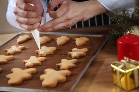 Decorating ginger bread man Stock Photos