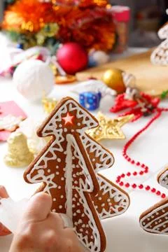 Decorating gingerbread cookies. Stock Photos