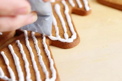 Decorating gingerbread cookies. Stock Photos