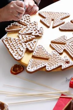 Decorating gingerbread cookies. Stock Photos