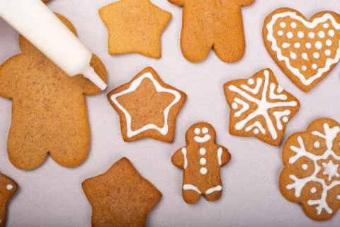 Decorating gingerbread cookies Stock Photos