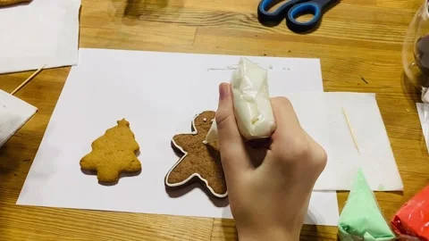 Decorating gingerbread cookies with royal icing for Christmas. Stock Footage 225515279