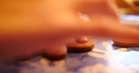 Decorating holiday gingerbread cookie close up on cookie Stock Footage 217360509
