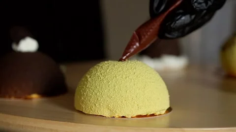 Decorating mini mousse pastry dessert covered with colorful velour. Modern cake. Stock Footage 142100173