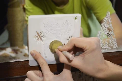 Decorating a mirror in a New Year's theme Stock Photos