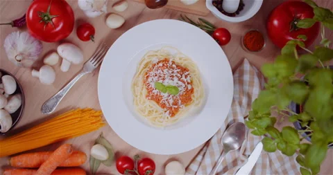 Decorating Pasta Bolognese with Basil Stock Footage 304881042