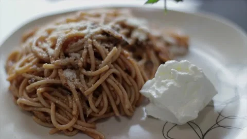 Decorating a pasta portion with an arugula leaf. Perfect Italian spaghetti Stock Footage 133220896
