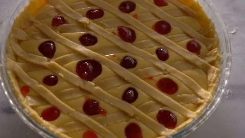 Decorating pie with strawberry jam. Top view Stock Footage 104432368