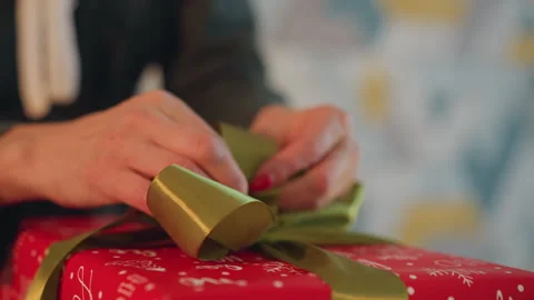 Decorating presents for festivities. Crafting perfect holiday gift presentation Stock Footage 338285957