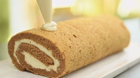 Decorating pumpkin roll with candied ginger. Stock Footage 159872218