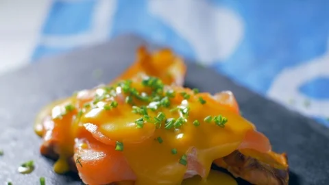 Decorating a salmon and orange suce dish Stock Footage 105877802