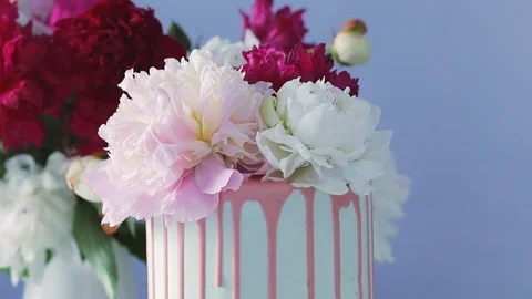 Decorating top of delicious wedding cake with peon buds. Stock Footage 105448163