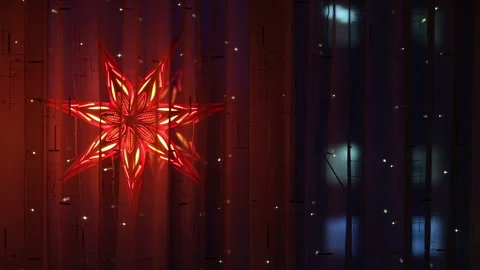 Decorating a window with a glowing star is a long-standing tradition in Catho Stock-Footage 145335898