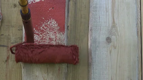 Decorating wooden   wall with paint roller Stock Footage 25910517