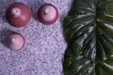 Decoration on a beige background from solid granite. Stock Photos