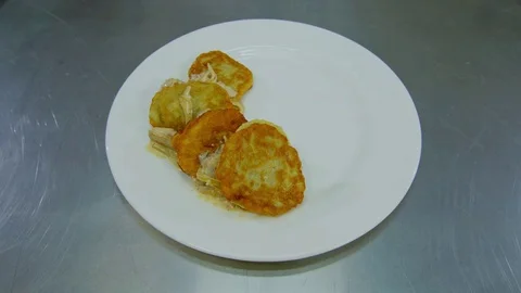 Decoration of the dish with hash Browns Video stock 70973799