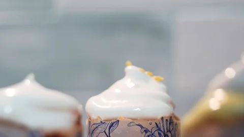 Decoration of the Easter cake, close-up. Sprinkle with colored edible Stock Footage 128758926
