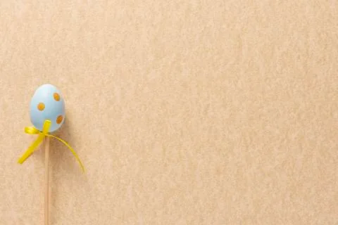 Decoration in the form of Easter eggs on a mustard background. Copy space Eas Stock Photos