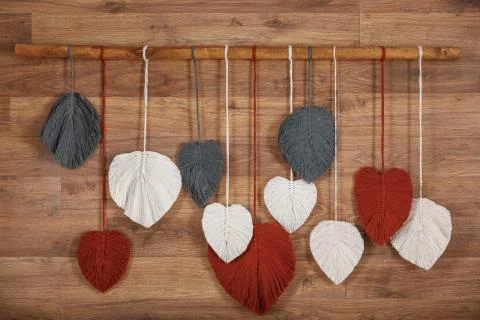 Decoration of macrame on the wall in the interior of the apartment Stock Photos