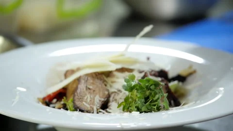 Decoration of the Meat Dish with Vegetables Video stock 131637110