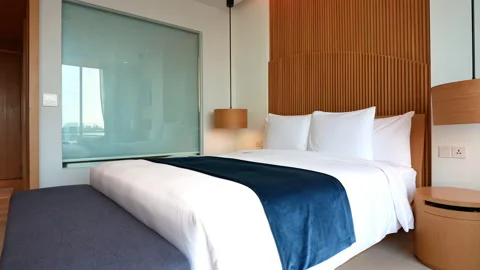Decoration of pillow on bed in bedroom interior Stock Footage 131131053