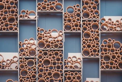 Decoration of plastic pipes in rectangle shaped shelves Stock Photos