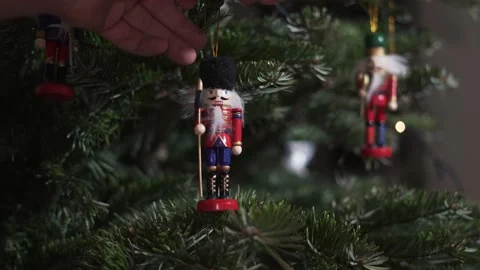 Decoration Toy Nutcracker on Christmas Tree 4K Shot. Nutcracker Soldier on Stock Footage 146105691
