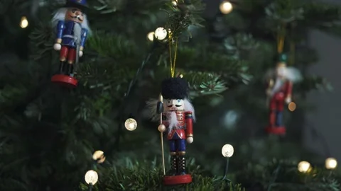 Decoration Toy Nutcracker on Christmas Tree. 4K Static Shot. Nutcracker Stock Footage 146105713