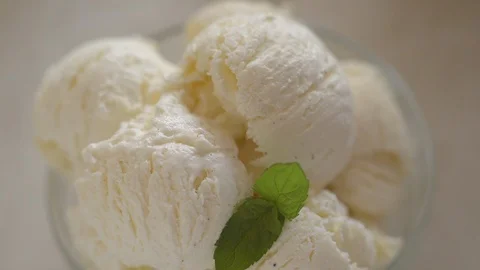 Decoration of vanilla ice cream from mint leaves and ripe strawberries Stock Footage 124257738