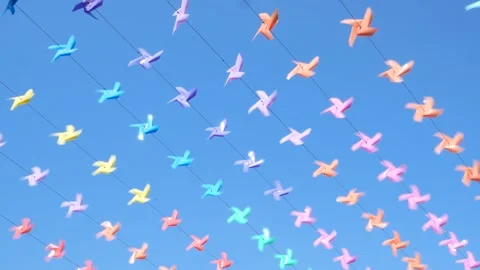 Decoration of the venue with small windmills of various colors during the New Ye Stock Footage 277522218