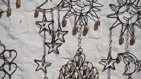 Decorations. A decorative moon and sun hang on a white wall. Stock Footage 286117381
