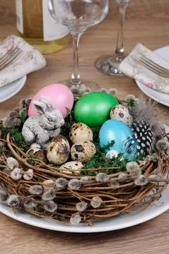 Decorations for Easter Easter colored eggs scattered on a green moss as an... Stock Photos