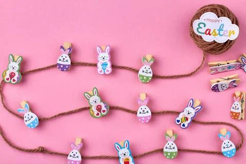 Decorations for easter. Vertical shot thread with clothes pins. Stock Photos