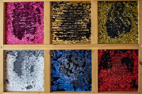 Decorations in the interior with multi-colored shiny surfaces in wooden frame Stock Photos